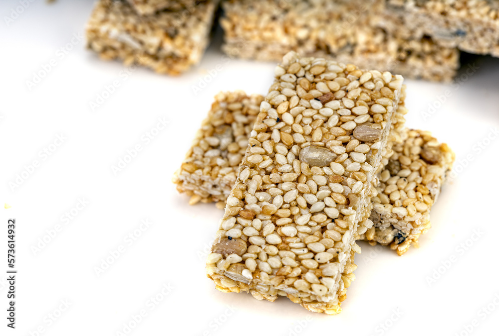 Sesame seeds Bar, Grain Bar, Nut Bars, Peanut Bar - sweet snack on white background Sesame seeds Bar, Grain Bar, Nut Bars, Peanut Bar - sweet snack on white background