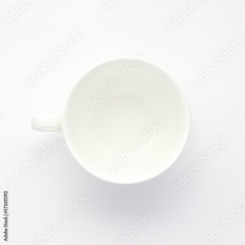 white cup on white surface 1x1