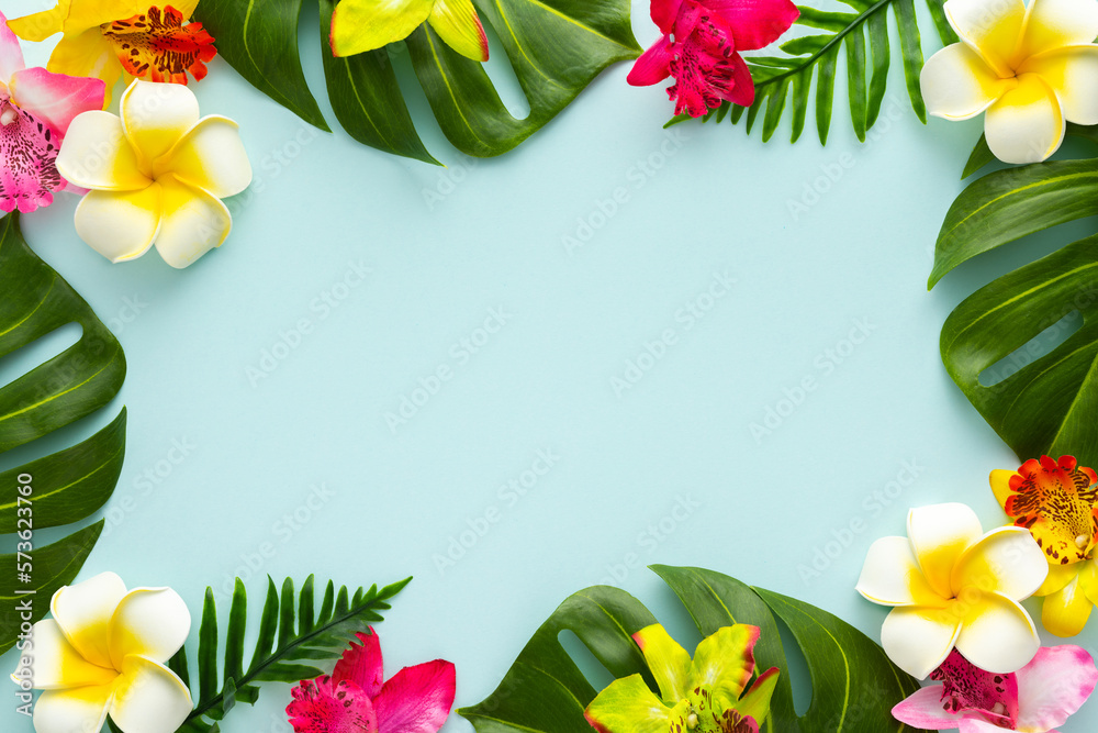 Summer background with tropical orchid flowers and green tropical palm leaves on light background. Flat lay, top view. Summer background with tropical orchid flowers and green tropical palm leaves on light background. Flat lay, top view.