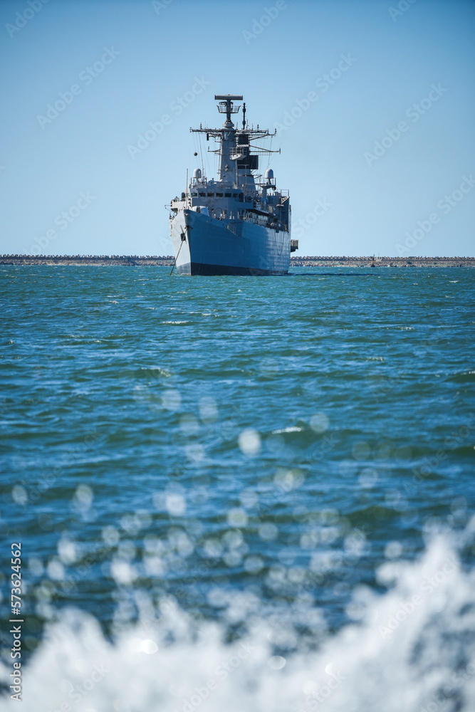 Obraz premium Warship sailing in still water