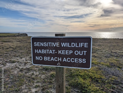 sensitive wildlife habitat sign board at Half Moon Bay hiking trail, no beach access sign board