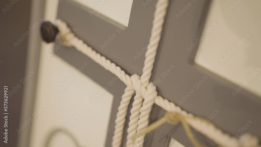 A cord of three strands religious cross