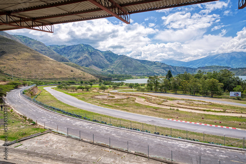 Abandoned Yahuarcocha race car circuit, with the Yahuarcocha lake in the background, on a beautiful sunny morning. Yahuarcocha, Imbabura province, Ecuador. photo