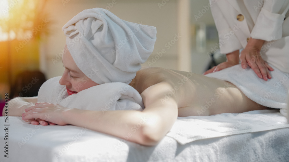 Beautiful young woman in spa salon. Woman relaxing at spa. Beauty, massage, Spa concept. Beautiful young woman in spa salon. Woman relaxing at spa. Beauty, massage, Spa concept.