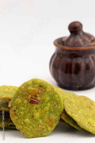 Namkeen Green Palak Masala Mathri Also Called Spinach Matthi, Mathiya, Mathi, Farsi Poori, Farsan, Pharsaṇ Or Mathari Is Famous Tea Time Snacks Consumed Mostly During Diwali, Holi, Karwa Chauth photo