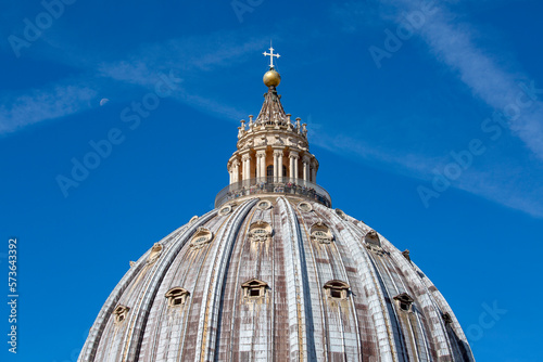 Dome of Saint Peter's Basilica at St.Peter's square on background of blue sky, Vatican, Rome, Italy.