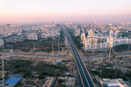 aerial drone still shot showing busy sohna elevated highway toll road with traffic stuck at interesction due to road construction of bridge or underpass © Memories Over Mocha