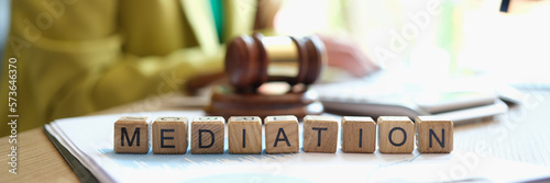 Obraz na płótnie Mediator sitting near gavel of judge and words mediation closeup w salonie