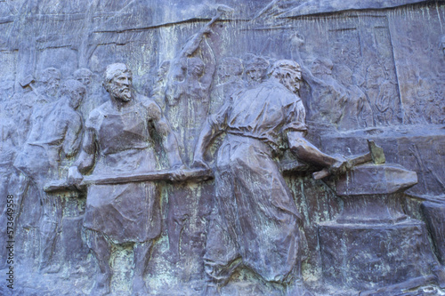 The Monument to the Army of the Andes, located on top of the Cerro de la Gloria, General San Martín Park, Mendoza, Argentine  relief bronze sculpture with workers forging steel for their weapons