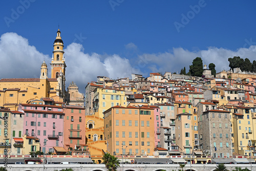 Church tower and colorful old buildings in Menton France