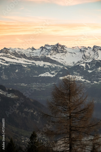 Orange sunset on alpine mountains and lake 