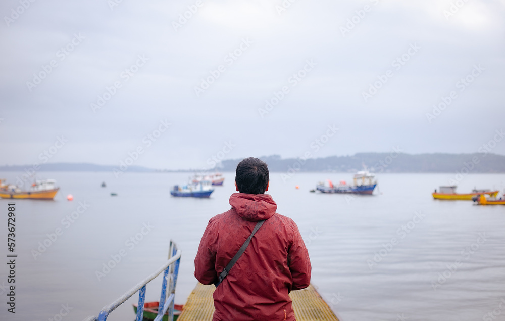 man looking at the sea