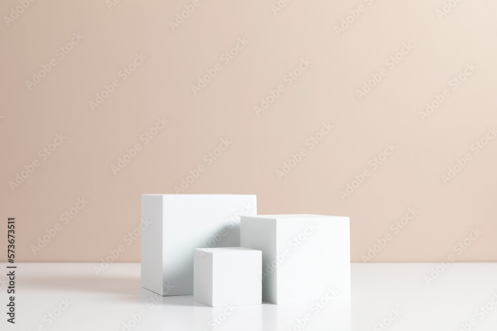 White quadrate pastel background for product presentation with shadow on beige table background. Podium, stage pedestal platform for cosmetic product. Empty square podium. Mockup. White quadrate pastel background for product presentation with shadow on beige table background. Podium, stage pedestal platform for cosmetic product. Empty square podium. Mockup.