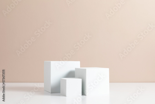 White quadrate pastel background for product presentation with shadow on beige table background. Podium, stage pedestal platform for cosmetic product. Empty square podium. Mockup.