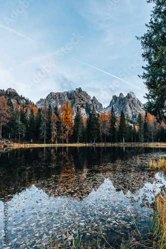 Fototapeta Naklejka Na Ścianę i Meble -  Autumn colours of Lake Lago d'Antorno and bridge in Dolomites Italy