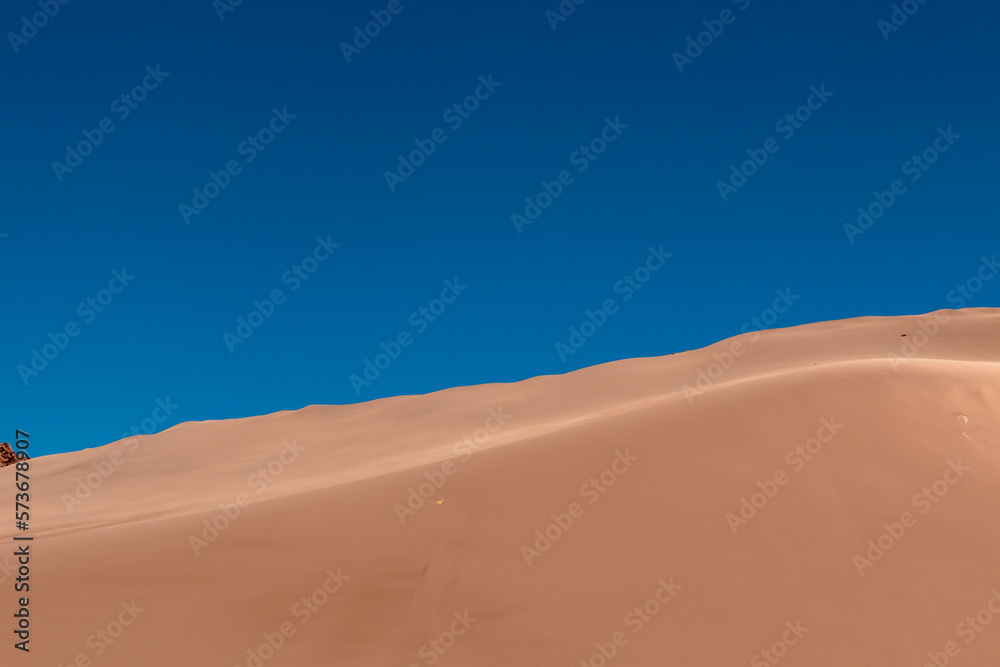 The landscape of golden sand dunes in The Atacama desert. Chile. Copy space. Wallpaper.