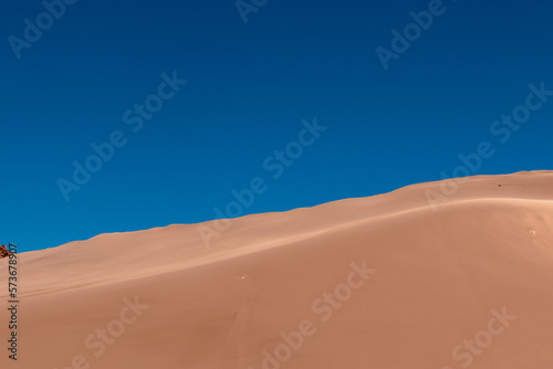 The landscape of golden sand dunes in The Atacama desert. Chile. Copy space. Wallpaper.