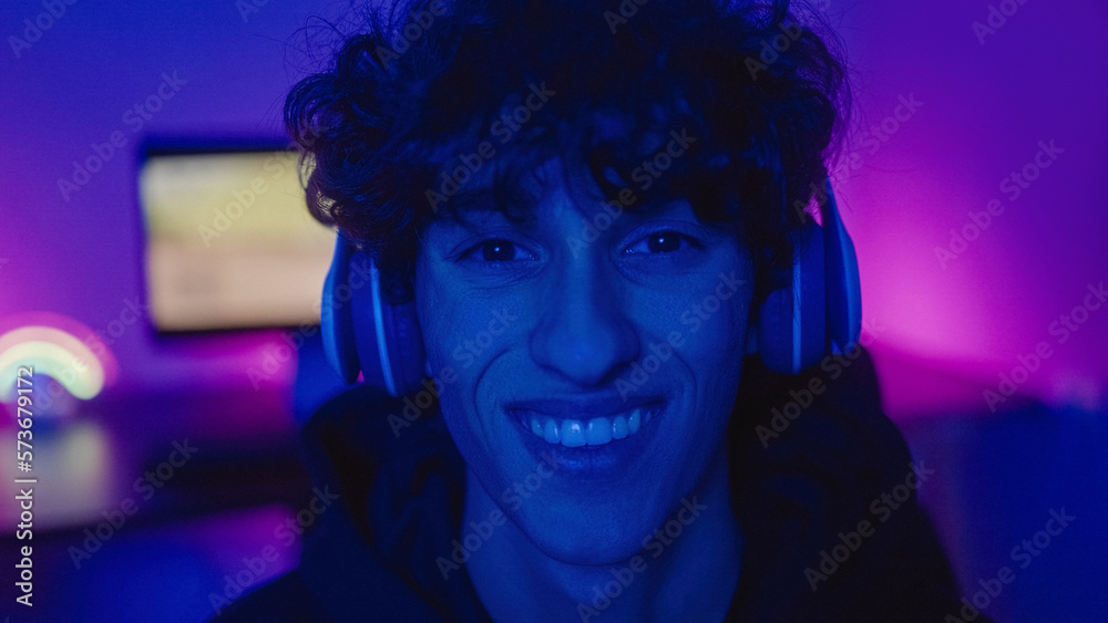 Young teenager gamer playing pc video games inside videogame room - Soft focus on face - Technology trend Young teenager gamer playing pc video games inside videogame room - Soft focus on face - Technology trend