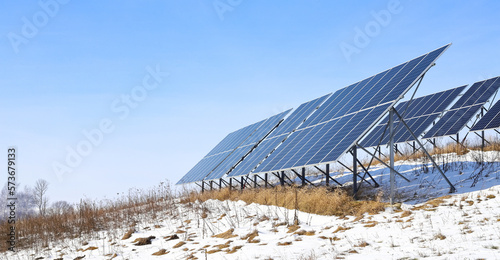 Solar cells Photoelectric cells on a bright, sunny, frosty winter day in the countryside. Solar batteries are an alternative energy.