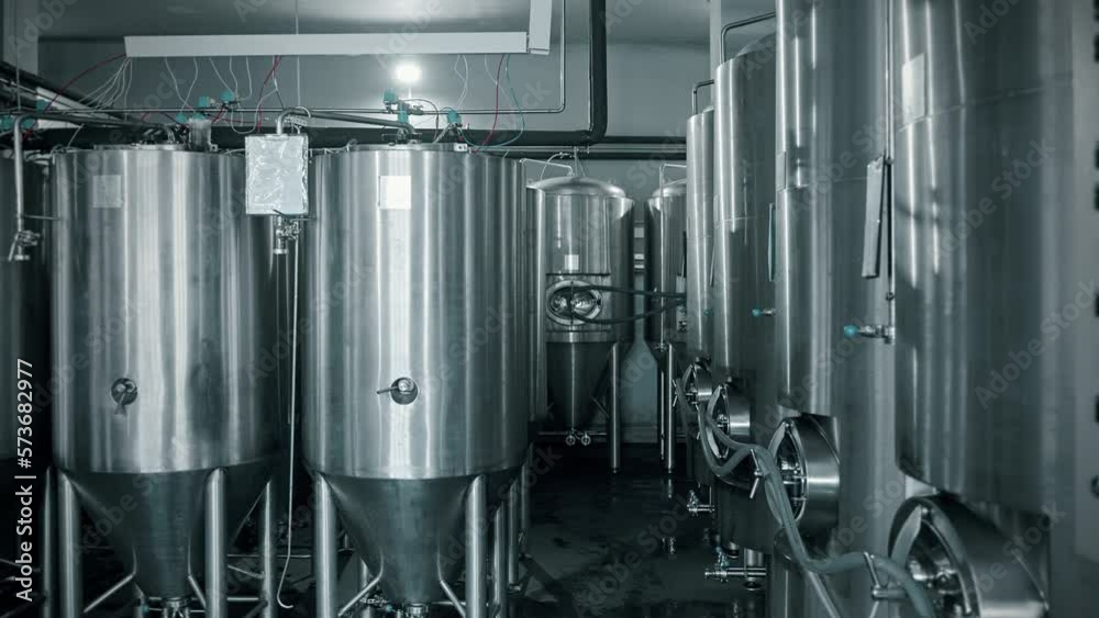 workshop of modern brewery, cylindrically-conical fermenter for fermenting beer