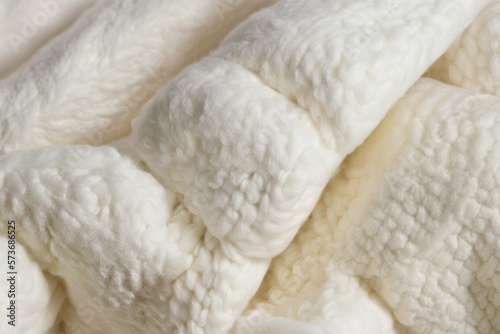 Closeup of a soft white material, woolen texture, fluffy and cozy, winter mood, Creamy Knitted Texture