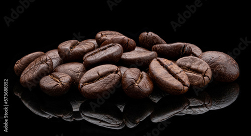 Roasted coffee beans on black background, full depth of field