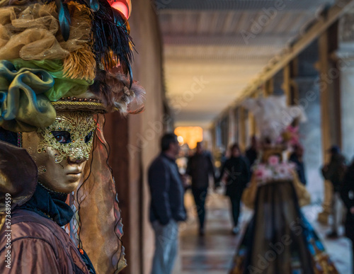 Fotobehang People wearing elaborate masks and costumes during the Venice carnival