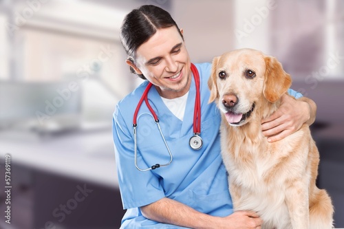 Fototapeta Naklejka Na Ścianę i Meble -  Veterinarian doctor with cute domestic dog in clinic