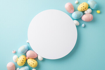 Easter celebration concept. Top view photo of ordered composition white circle yellow blue and pink easter eggs on isolated pastel blue background with copyspace