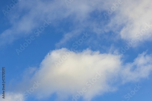 Beautiful view of white clouds on blue sky background.  © Alex