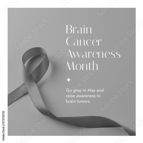 Composition of brain cancer awareness month text over ribbon on grey background