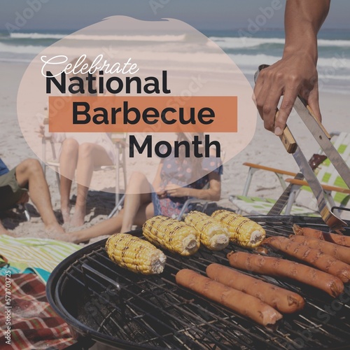 Composite of celebrate national barbecue month text over cropped hand cooking food on bbq at beach