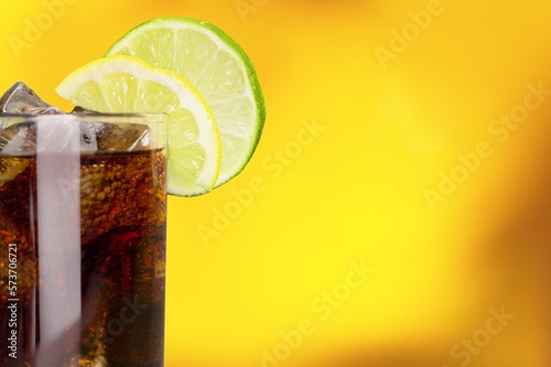 refreshing tasty sweet cola with cold ice cubes photo