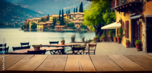 Empty wooden table top with blurred lakeside cafe on a gorgeous Italian lake in the evening. vacation concept. for mounting your product. digital art © Viks_jin