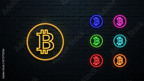 A set of multicolored icons of the Bitcoin cryptocurrency. Neon glowing BTC symbols in seven colors.