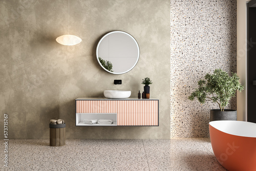 Foto Modern minimalist bathroom interior, modern pink bathroom cabinet, white sink, wooden vanity, interior plants, bathroom accessories, orange-white bathtub, concrete wall, terrazzo flooring