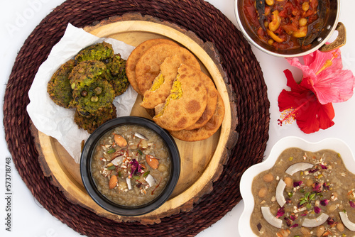 Dal Bhari Poori, Dholl Puri, Cholar Dal, Luchi Served With Gur Ki Kheer Or Jaggery Rice Pudding, Nolen Gurer Payesh, Rasiya, Payasam, Hara Chana Or Chholia Pakoda Bhabhra, Tamatar Ki Meethi Chutney