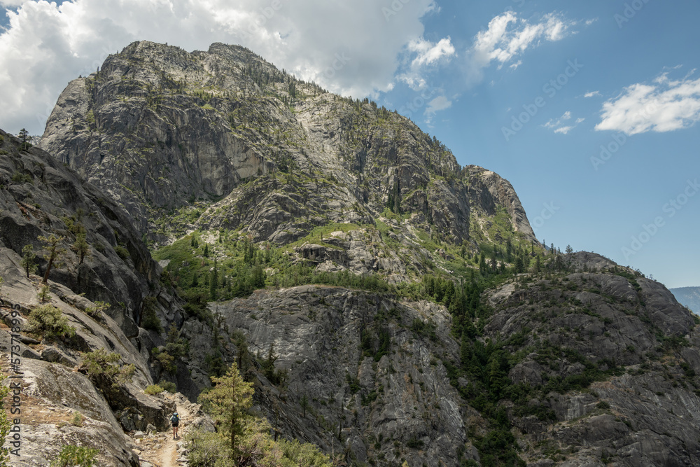 Hiker Below Large Mountain In Backcountry of Yosemite