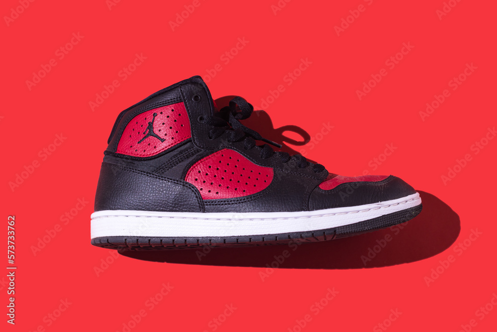 Black and red NIKE Jordan Access shoes on a red background. Concept of  sneaker, basketball, retro, michael jordan, fashion, collection and casual  Stock Photo | Adobe Stock