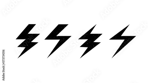 Textured lightning bolt set. Black grunge flash thunderbolt symbols collection. Strike arrow signs. Vector illustration 