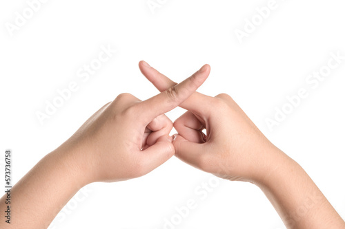 Woman hands making sign cross fingers isolated on white background.