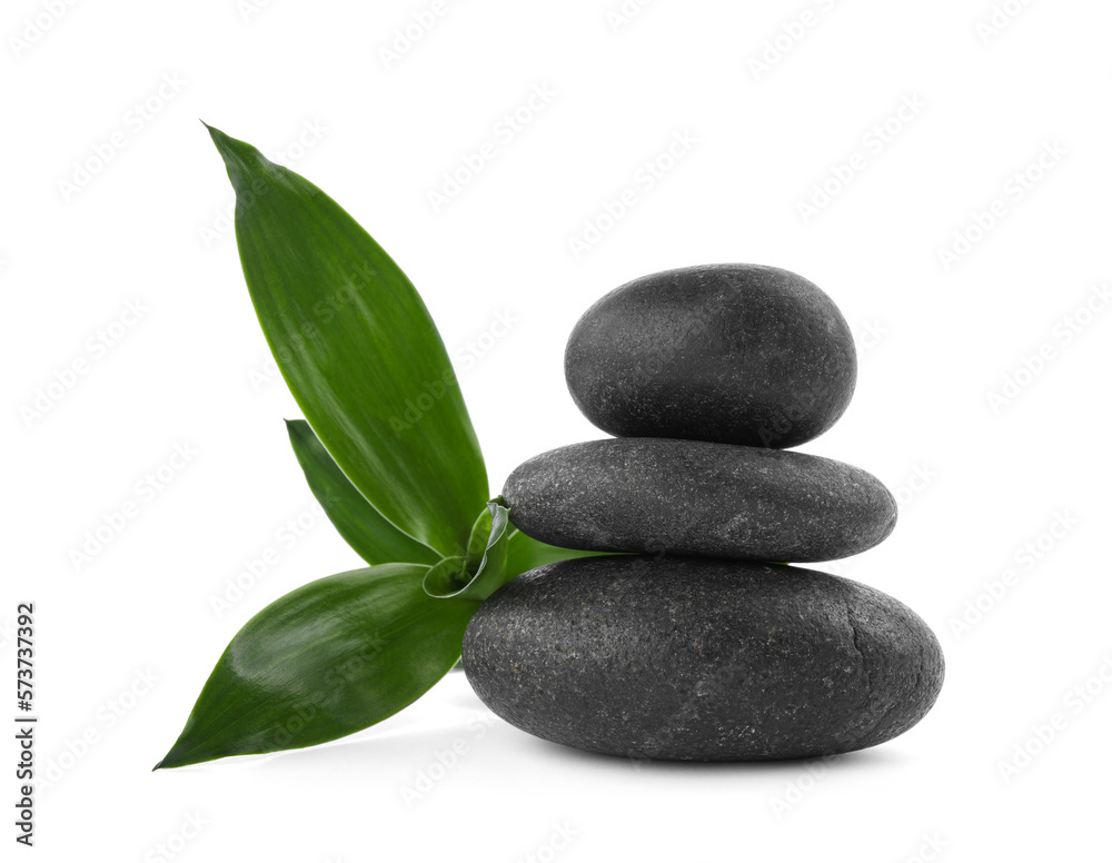 Stack of spa stones and bamboo isolated on white Stack of spa stones and bamboo isolated on white