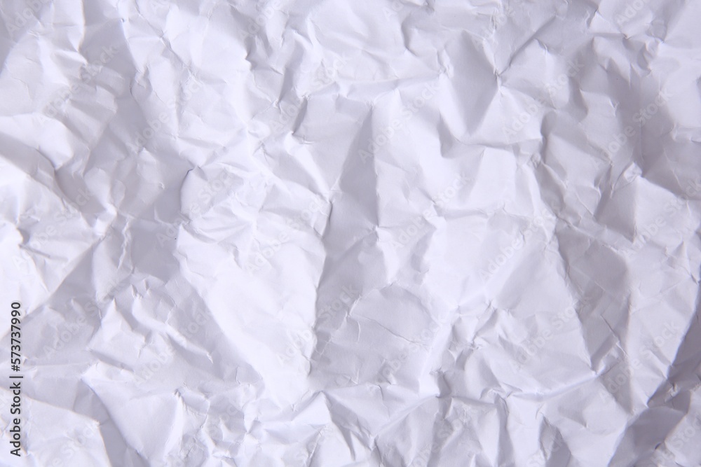 Sheet of crumpled paper white as background, top view Sheet of crumpled paper white as background, top view