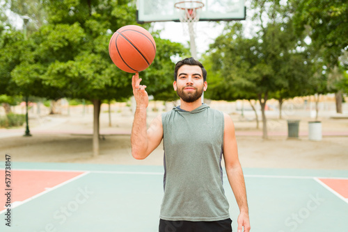 Active latin man having fun playing basketball © AntonioDiaz