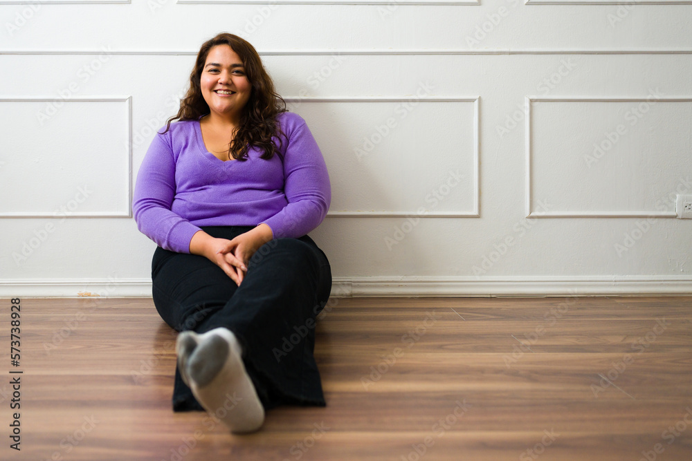 Portrait of a cheerful big woman relaxing at home Portrait of a cheerful big woman relaxing at home