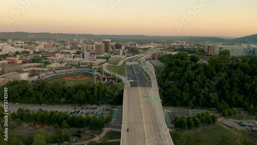 Aerial 4K Video Over a Highway in the Downtown of a City as Cars Drive Past Drone Capture of Chattanooga, Tennessee at Sun Set in the Spring