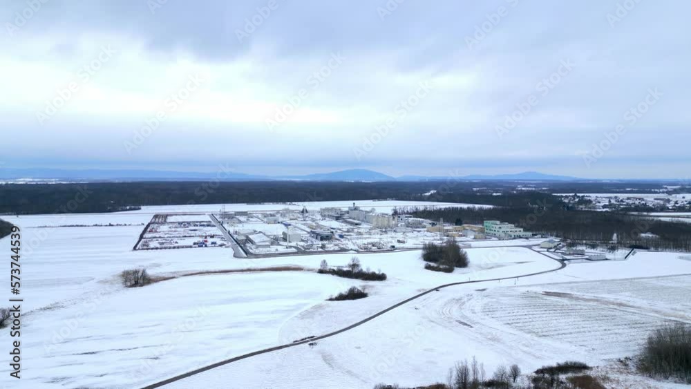 Picturesque Snowy Landscape Surrounding Natural Gas Compressor Station In Winter. wide aerial Picturesque Snowy Landscape Surrounding Natural Gas Compressor Station In Winter. wide aerial