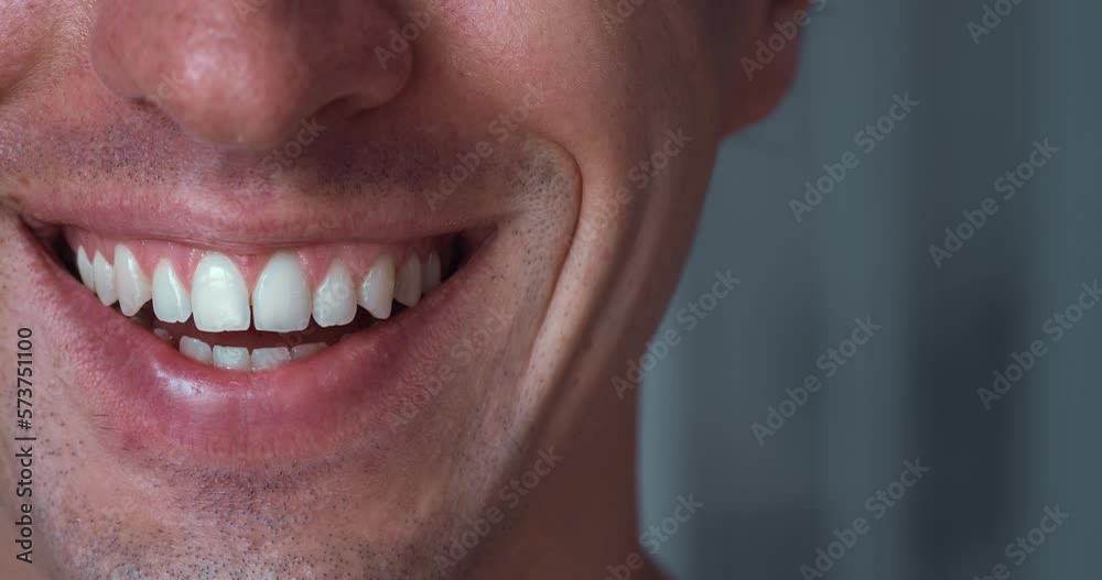 Close-up half face happy man 30s smiling with white teeth. Closeup caucasian man's mouth smiling with teeth. Handsome male smile, macro shot. Close-up half face happy man 30s smiling with white teeth. Closeup caucasian man's mouth smiling with teeth. Handsome male smile, macro shot.