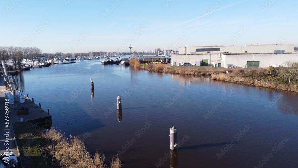 Industrial area near Dinteloord in the Netherlands. A place on the water where transport of water sports items with a port nearby.