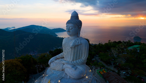 big buddha on high mountain in Phuket Thailand Amazing light of sunset nature Landscape nature background